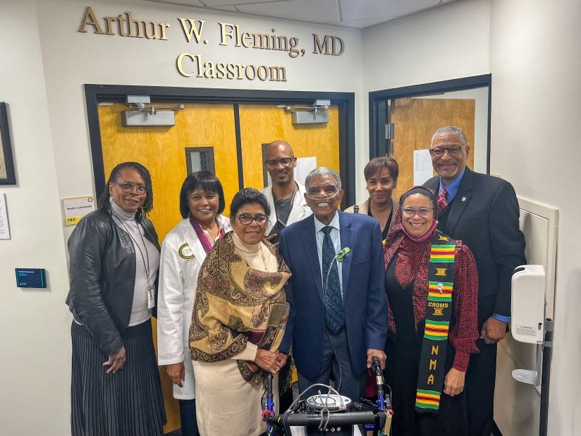 Group photo in front of the Dr. Arthur W. Fleming Classroom