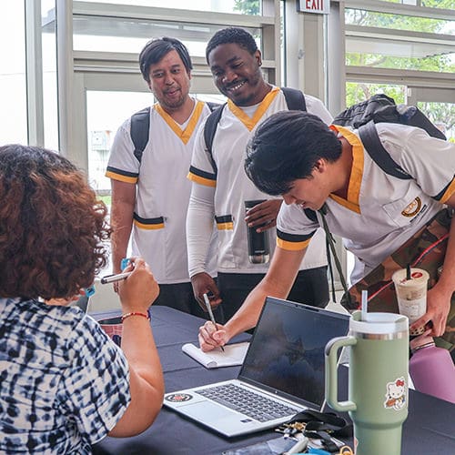 CDU Rising | Students at a table