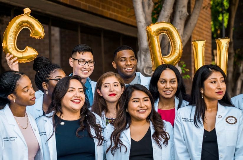 CDU students in white coats