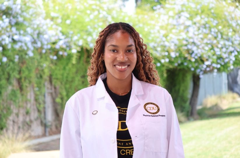 student wearing white coat